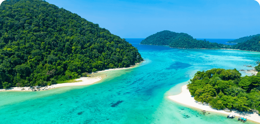 Serene beach coastline with gentle waves and clear sky